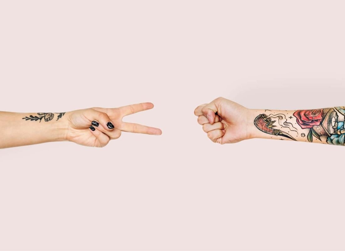 Hands playing rock-paper-scissors