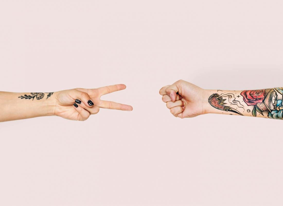Hands playing rock-paper-scissors